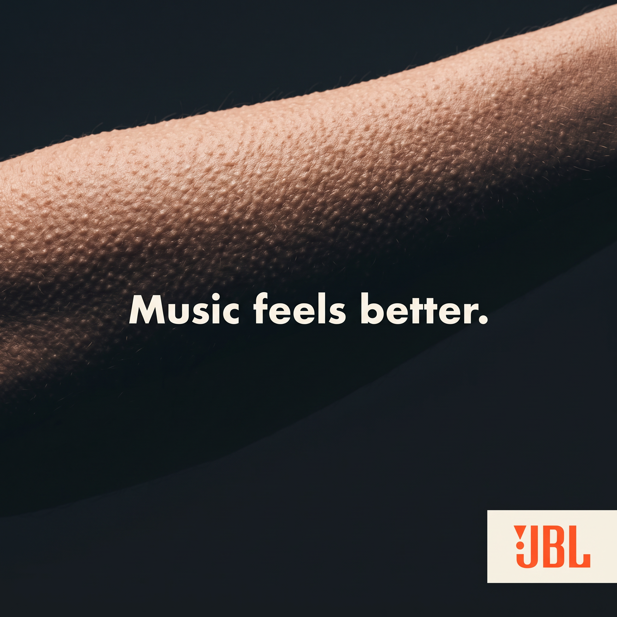 Close-up of a forearm covered in goosebumps on a dark background with the text Music feels better and the JBL logo