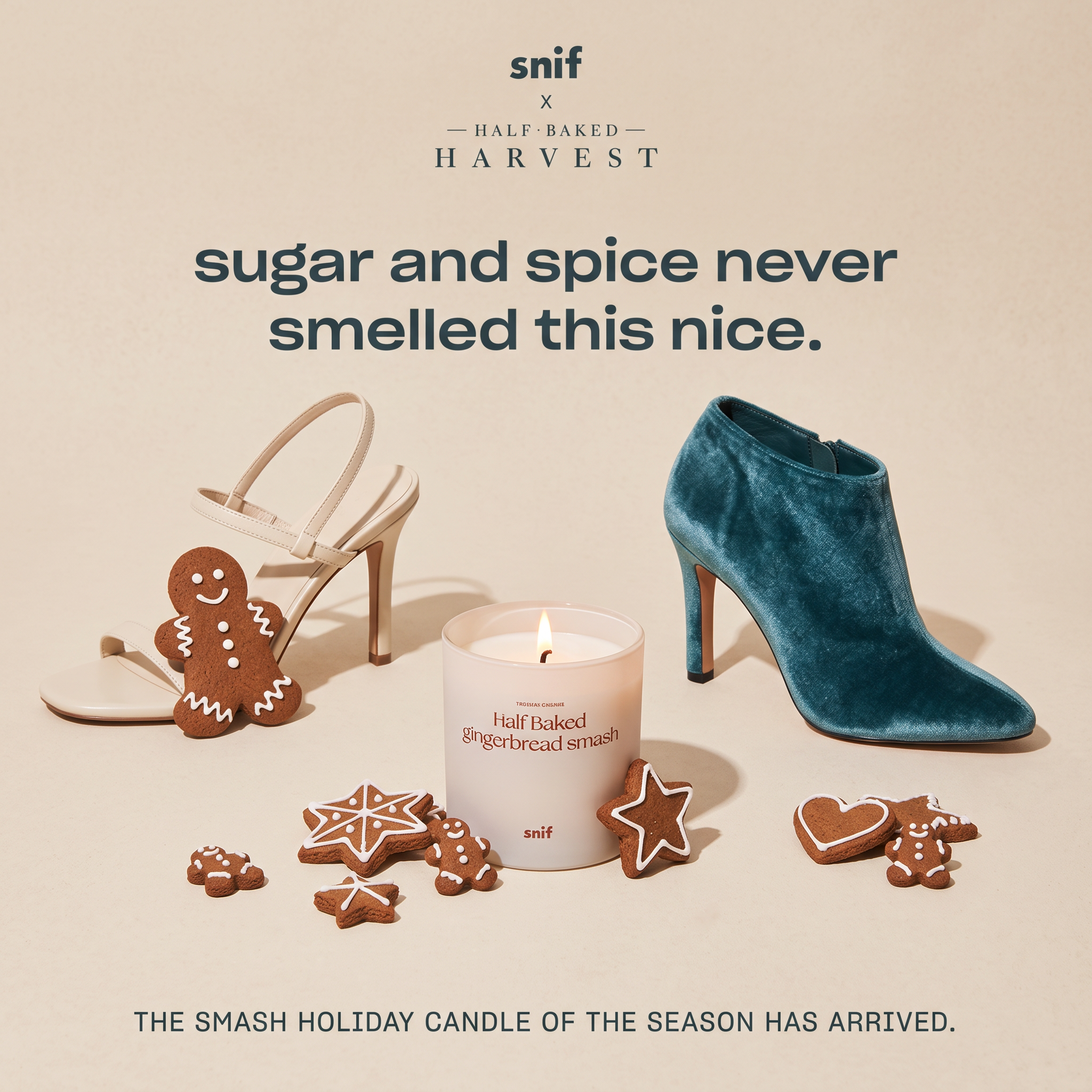 Lit Snif gingerbread candle surrounded by iced gingerbread cookies, a cream heeled sandal and a teal velvet boot on beige