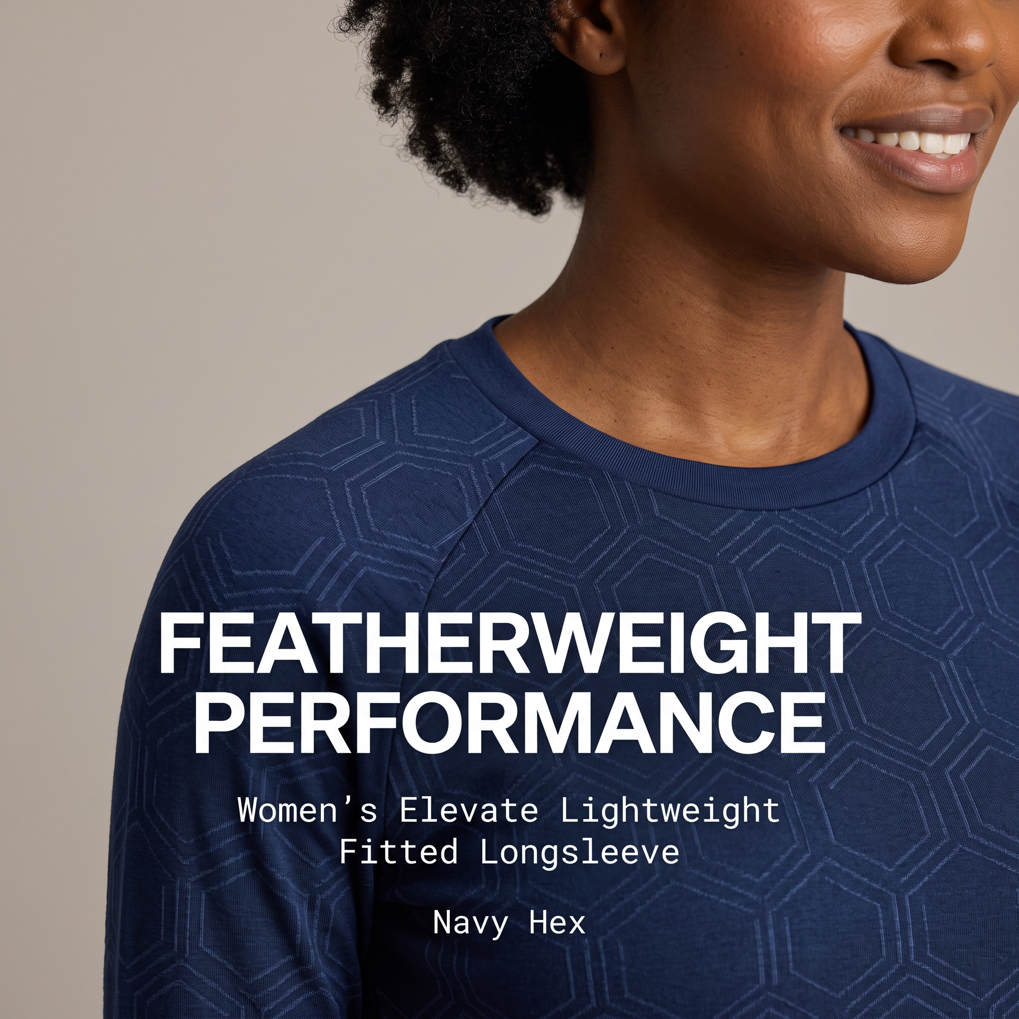 Close-up of smiling woman wearing navy hex-pattern fitted longsleeve with white text Featherweight Performance