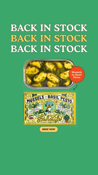 Green ad with 'Back in Stock' repeated three times above an open tin of mussels in basil pesto and its yellow box
