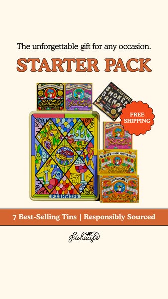 Fishwife stained-glass gift tin with stacked colorful tins, free shipping badge and orange banner on a cream background