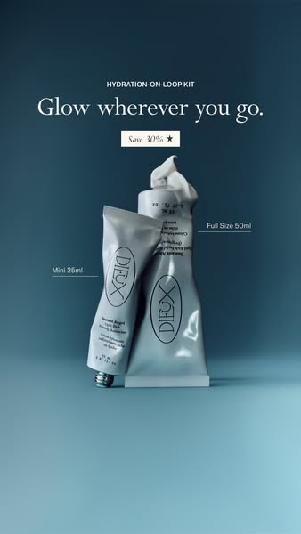Full-size and mini Dieux Instant Angel moisturizer tubes leaning together on a dark teal background