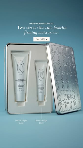 Open embossed silver tin holding 50ml and 25ml Dieux Instant Angel moisturizer tubes on teal background