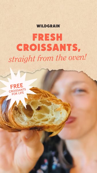 Woman holding a halved croissant showing flaky layers, with a 'free croissants for life' starburst badge on kraft paper