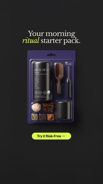 MUD WTR starter kit in a purple blister pack with tin, wooden scoop, frother, black mug and spices on a black background
