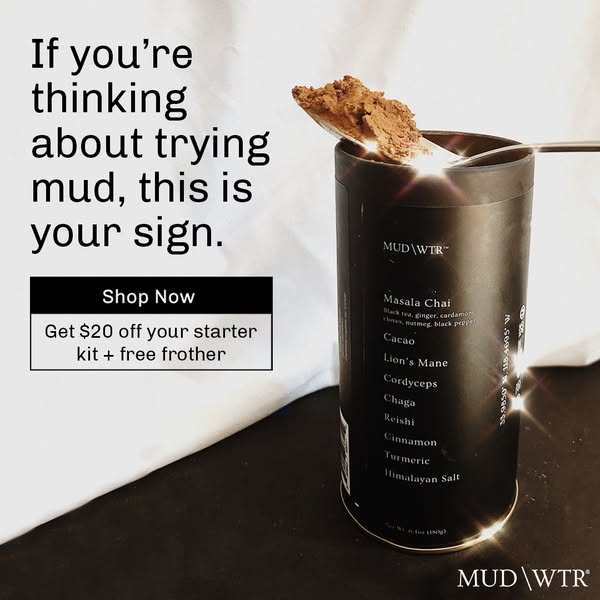 Spoonful of MUD WTR powder on top of a black tin with sparkling backlight and a $20 off starter kit offer box