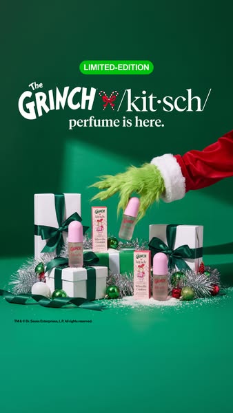 Grinch x Kitsch perfume bottles, gift boxes and tinsel on green as a furry green gloved hand reaches in for a bottle