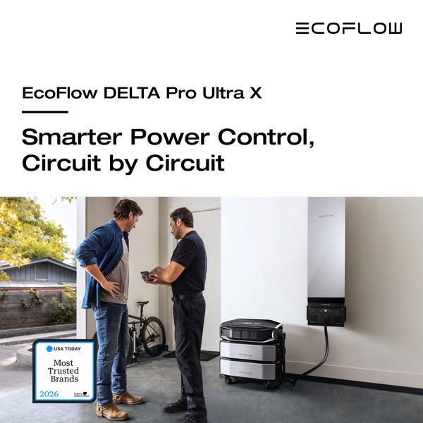 Installer shows a homeowner the EcoFlow app on a phone next to a DELTA Pro Ultra X battery and wall-mounted smart panel