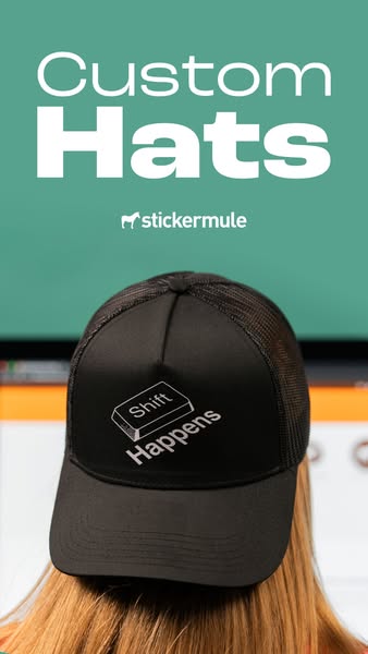 Person seen from behind in a black trucker hat printed with a Shift key and Shift Happens, teal background, Custom Hats