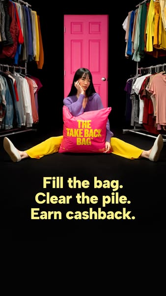 Woman sitting in a split with a pink Take Back Bag between clothing racks and a pink door, text Fill the bag. Clear the pile. Earn cashback.