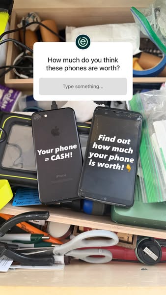 Two old phones in a cluttered junk drawer under a question sticker asking what they are worth, text Your phone = CASH
