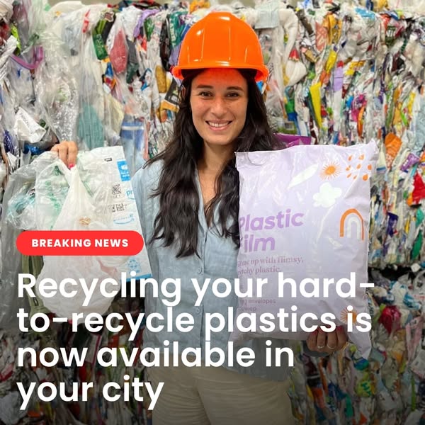 Smiling woman in an orange hard hat holding a lilac Plastic Film bag in front of bales of plastic, breaking news text