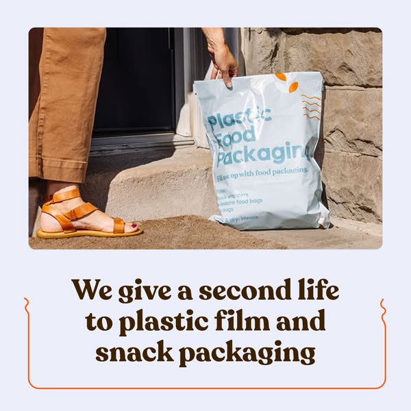Person in sandals placing a blue Plastic Food Packaging bag on a sunny stone doorstep for recycling pickup
