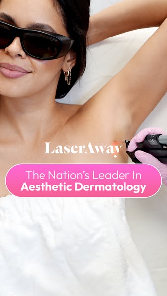 Woman in protective glasses lying back during underarm laser hair removal with LaserAway market leader banner