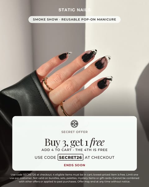 Hand in a black leather jacket with smoky black press-on nails and clear tips above a white Buy 3 Get 1 Free offer card