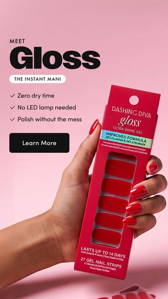 Dashing Diva Gloss ad showing a hand with glossy red nails holding the red Gloss pack upright against a soft pink backdrop