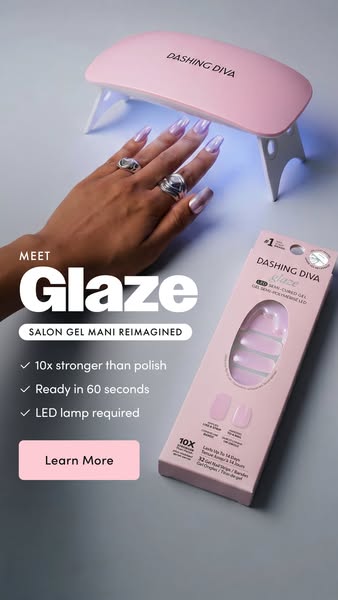 Dashing Diva Glaze ad showing a hand with long lilac chrome Glaze nails under the pink Dashing Diva mini LED lamp, with...