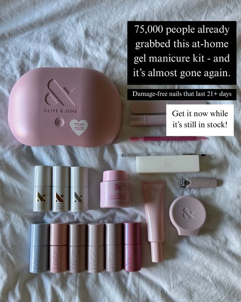 Olive & June gel manicure kit with pink UV lamp, gel polishes and tools laid out on white sheets with social proof text