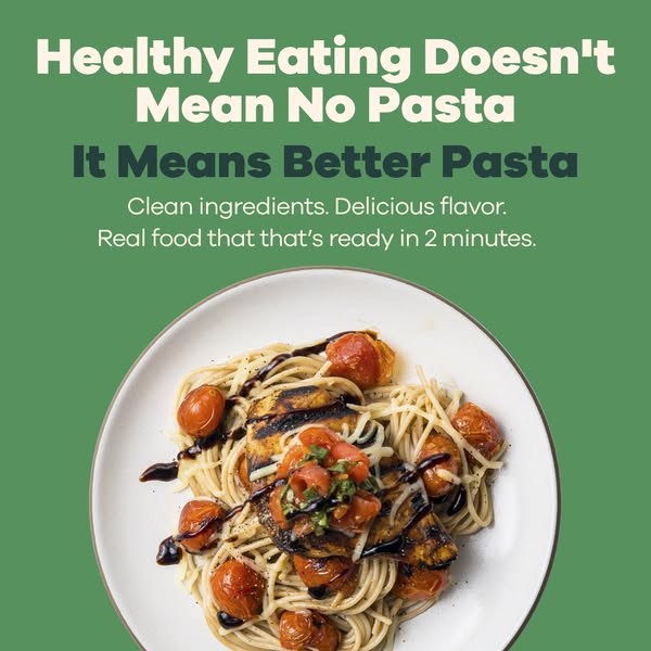 Plate of spaghetti with grilled chicken, roasted cherry tomatoes and balsamic on green with headline It Means Better Pasta