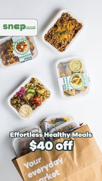 Top-down flat lay of Snap Kitchen meal trays and a paper grocery bag with text Effortless Healthy Meals $40 off