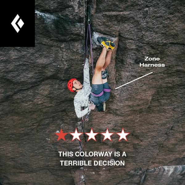 Climber upside down in a rock crack in a Black Diamond Zone Harness with a one-star review mocking the colorway