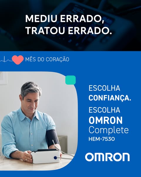 Man measuring blood pressure at a table with Omron Complete HEM-7530 under the headline Mediu errado, tratou errado