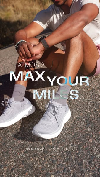 Male runner seated on asphalt in grey Topo Atmos 2 running shoes with text Atmos 2 Max Your Miles