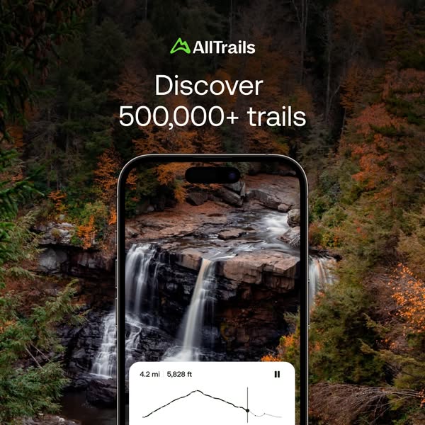 AllTrails square ad: phone showing a waterfall and elevation chart in an autumn forest, text 'Discover 500,000+ trails'