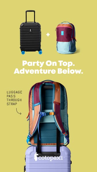 Colorful Cotopaxi backpack strapped over a lilac suitcase handle on a yellow background with a pass-through strap callout