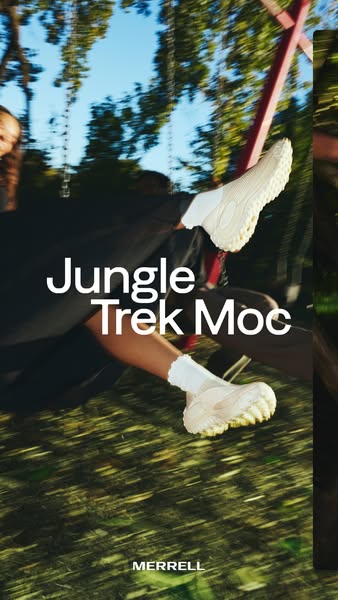 Legs in white socks wearing cream Merrell Jungle Trek Moc shoes swinging against blurred trees and sky